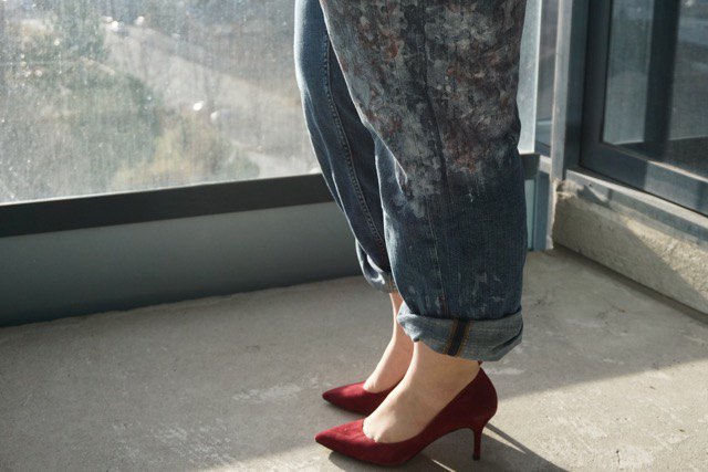 Gray blue cuffed straight leg jeans with burgundy suede pointed heels
