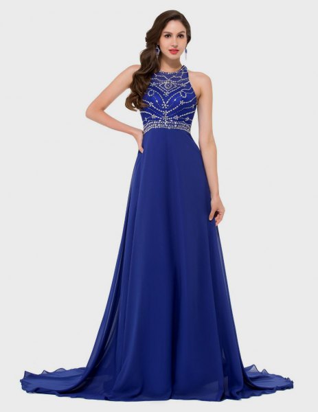 Long royal blue dress with a halterneck and sequins and a detailed cut