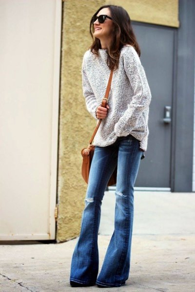 Pair a heather gray sweater with blue ripped flared jeans