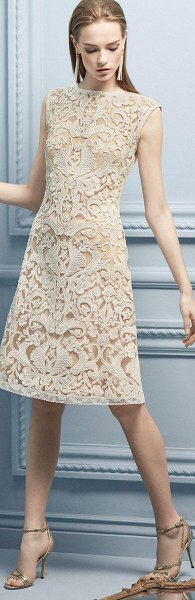 Ivory, sleeveless, knee-length lace dress with a high neck and open
toe heels