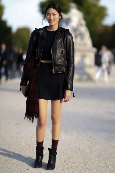 Leather jacket with black cropped t-shirt and mini skirt