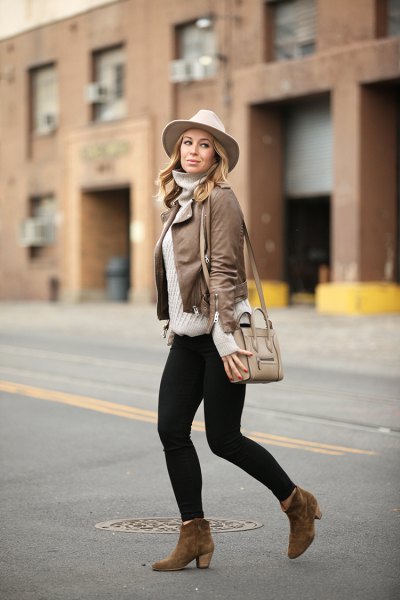 Leather jacket with gray turtleneck and white felt hat