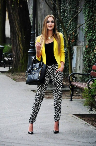 Lemon yellow summer blazer with black waistcoat and pants with
tribal pattern