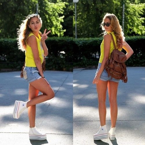 Lemon yellow tank top with blue denim shorts and white platform high-top sneakers