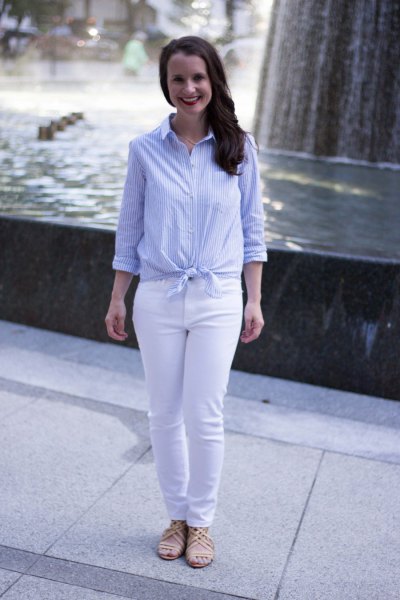 Light blue and white vertical striped knotted shirt with slim fit jeans