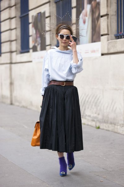 Light blue blouse with black belted pleated midi skirt