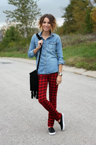 Light blue button down chambray shirt and red and black plaid trousers