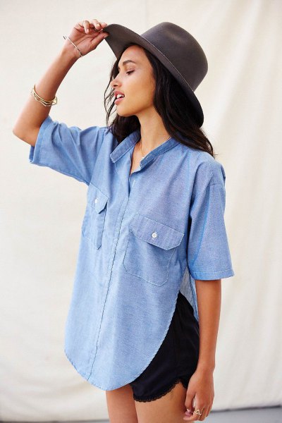 Light blue chambray shirt with side slits and short sleeves and
black mini shorts