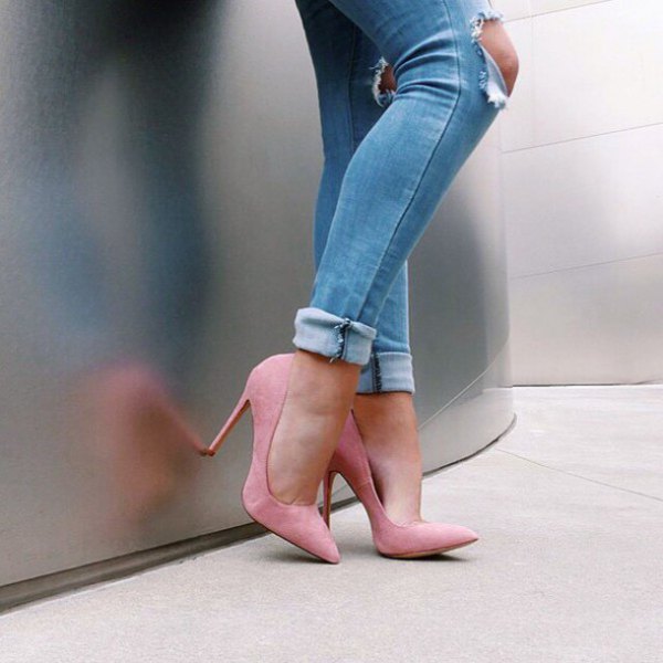 Light blue ripped skinny jeans with cuffs and pale pink ballet flats