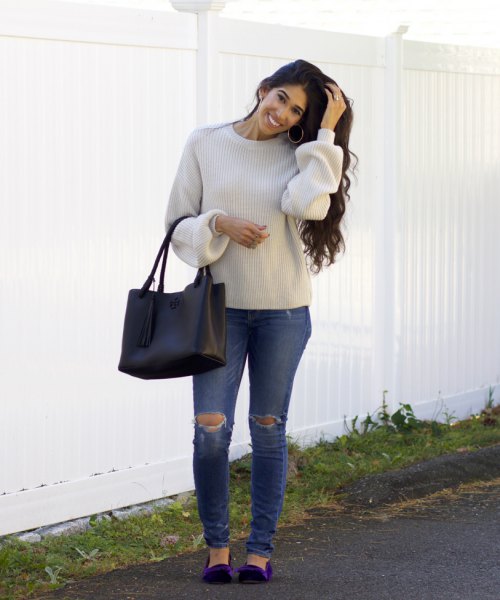 Light gray crew neck sweater, ripped jeans and navy velvet flats
