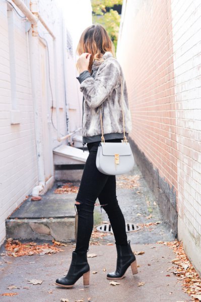 Light gray jacket with black ripped skinny jeans and black leather boots