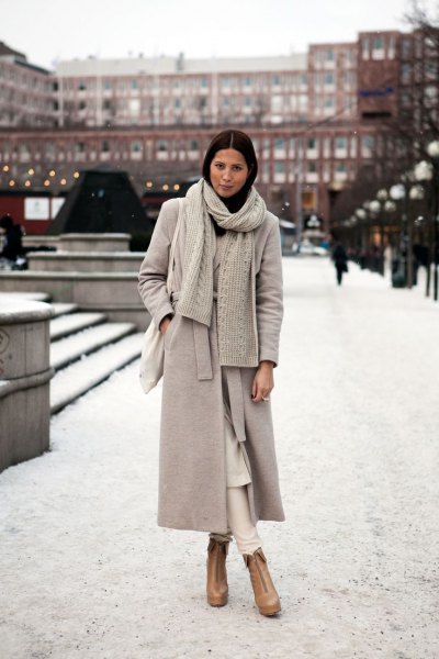 Light gray maxi wool coat with knitted scarf and brown boots
