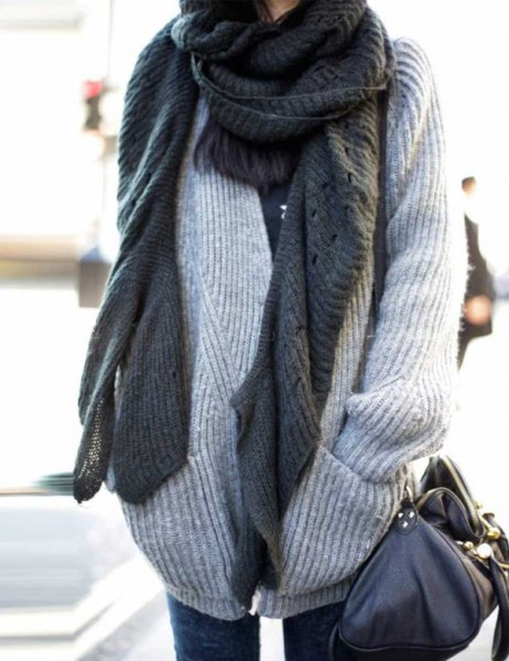 Light gray ribbed chunky knit jumper with a scarf worn as a scarf