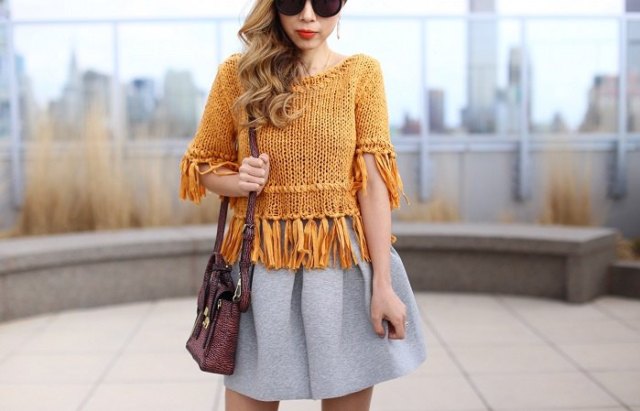 Lime green fringe knit sweater with gray pleated mini skater cotton skirt
