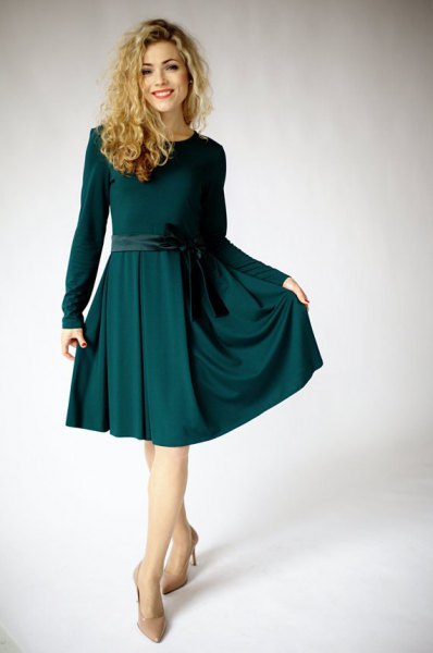 Dark green long sleeve flared midi dress with light pink heels