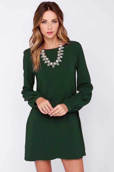 Long sleeve mini shift dress with silver statement necklace