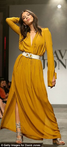 Mustard colored maxi dress with long sleeves and white wide
belt