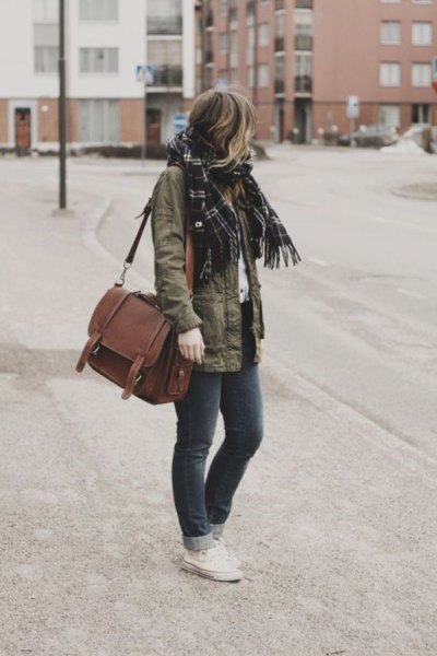 Military jacket with black plaid scarf and brown suede shoulder
bag