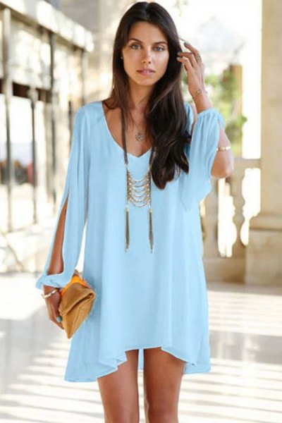 Light blue mini long sleeve dress with a boho statement
necklace