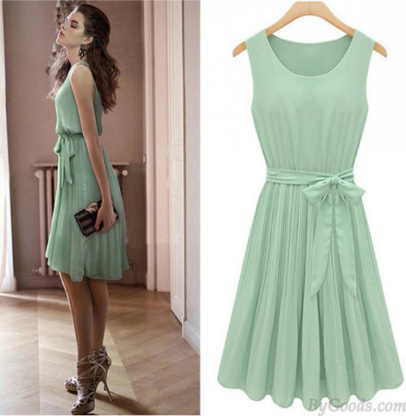 Mint green knee length pleated skater dress with tie waist and strappy heels