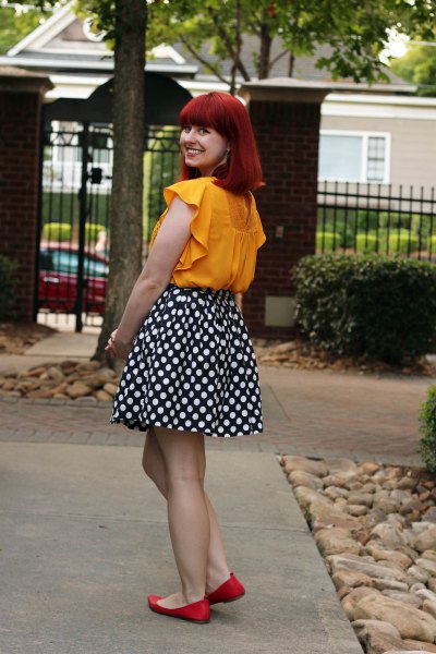 Mustard sleeveless blouse with black and white polka dot skater skirt