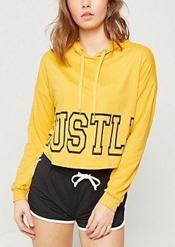 Mustard printed hoodie with black mini running shorts