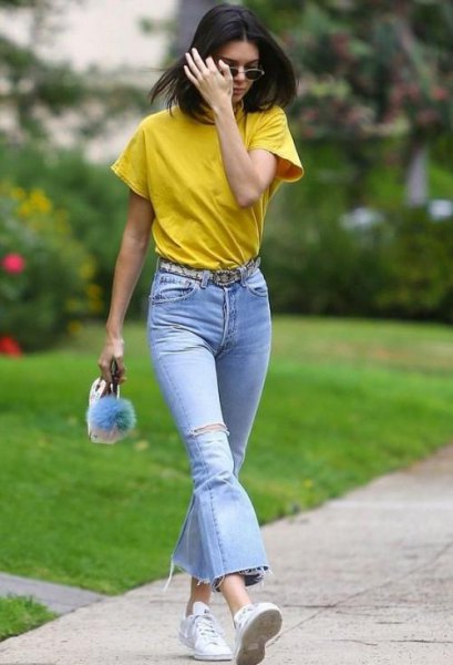 Mustard colored t-shirt with light blue flared jeans
