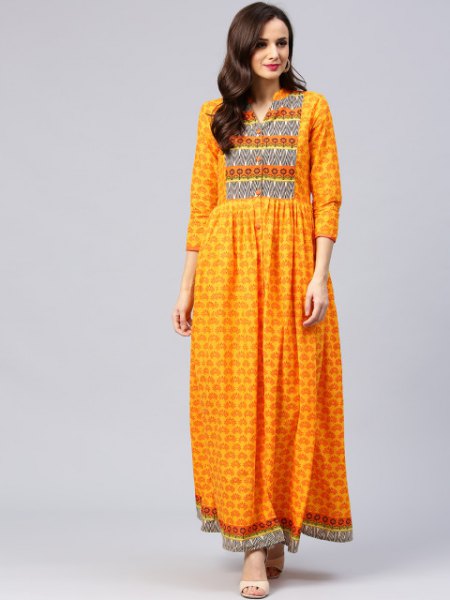 Mustard colored maxi dress with three quarter sleeves and tribal
print