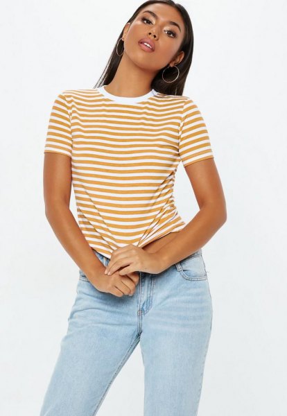 Mustard yellow and white striped fitted t-shirt with light blue slim fit jeans