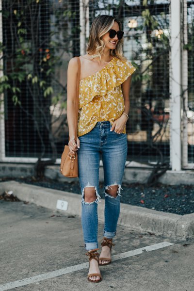 Mustard yellow ruffled one shoulder top and ripped jeans