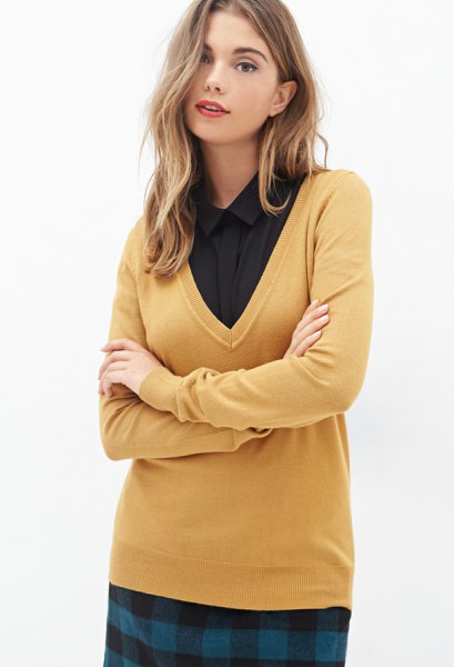 Mustard yellow V-neck sweater and black button down shirt