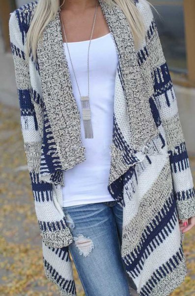 Navy blue and gray striped long knit cardigan with light blue ripped jeans