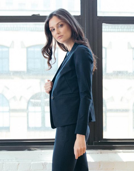 dark blue blazer jacket with white blouse and tight pants