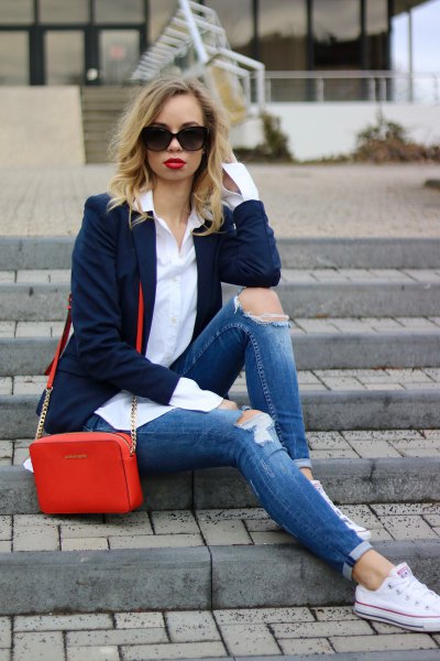 Navy blue blazer with slim fit cuffed jeans and white low top sneakers