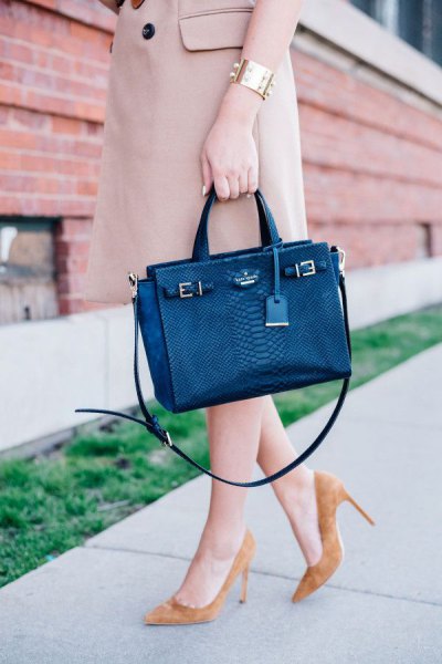 dark blue briefcase with pale pink longline trench coat