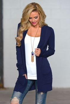 Navy blue cardigan with white scoop neck bodice and boho necklace