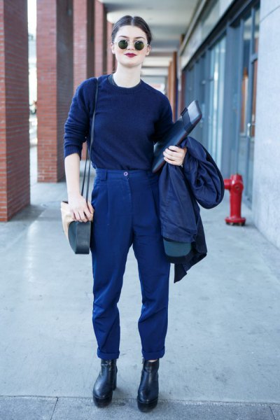 dark blue sweater with matching trousers and leather boots