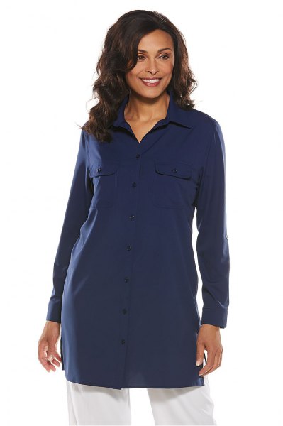 Navy blue tunic shirt with white wide leg jeans