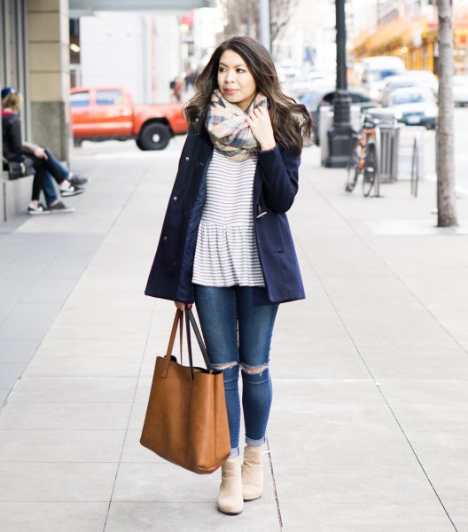 Oversized wool coat with a black and white striped peplum top and jeans