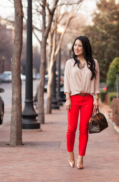 pale pink blouse with red cropped trousers and rose gold heels