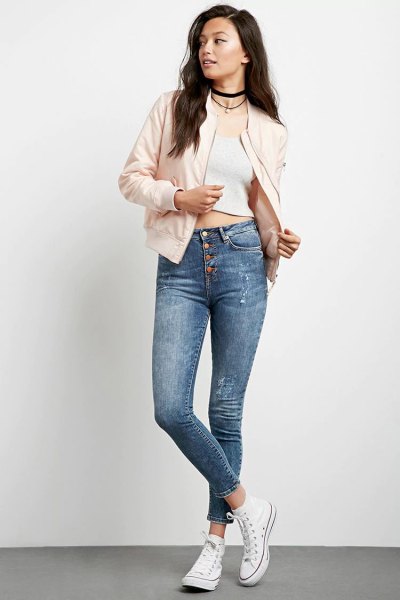 pale pink bomber jacket with white cropped tank top