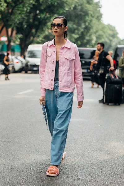 Light pink denim jacket with black deep V-neck tank top and wide leg jeans