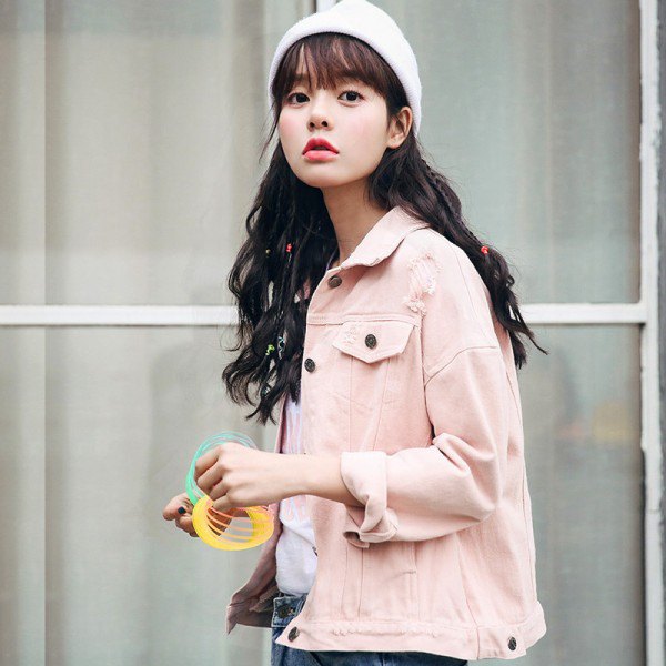 pale pink denim jacket with blue jeans and white knit hat