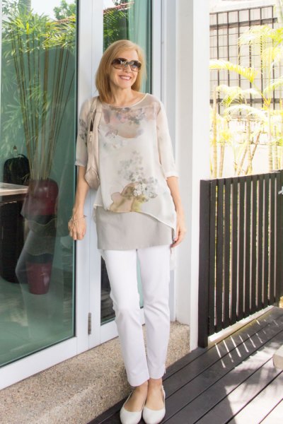 Light pink sheer floral chiffon blouse and white slim fit jeans