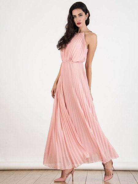 Light pink halterneck maxi dress in pleated chiffon with a flared silhouette
