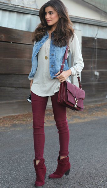 pale pink long sleeve t-shirt with light blue denim vest and burgundy short boots