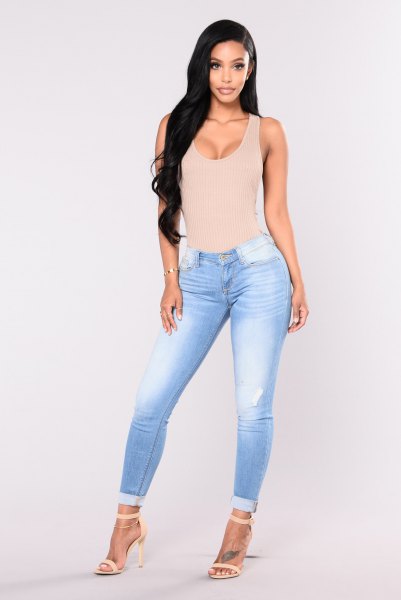 Light pink low-cut fitted tank top with sky blue low-rise skinny jeans