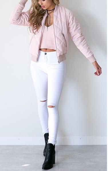 light pink quilted bomber jacket with high waisted white skinny jeans
