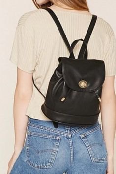 pale pink ribbed top with small backpack handbag in black leather and denim
