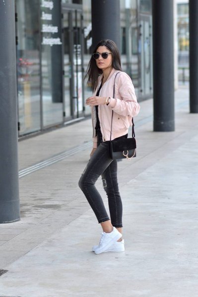 Light pink cropped bomber jacket paired with black cropped skinny
jeans